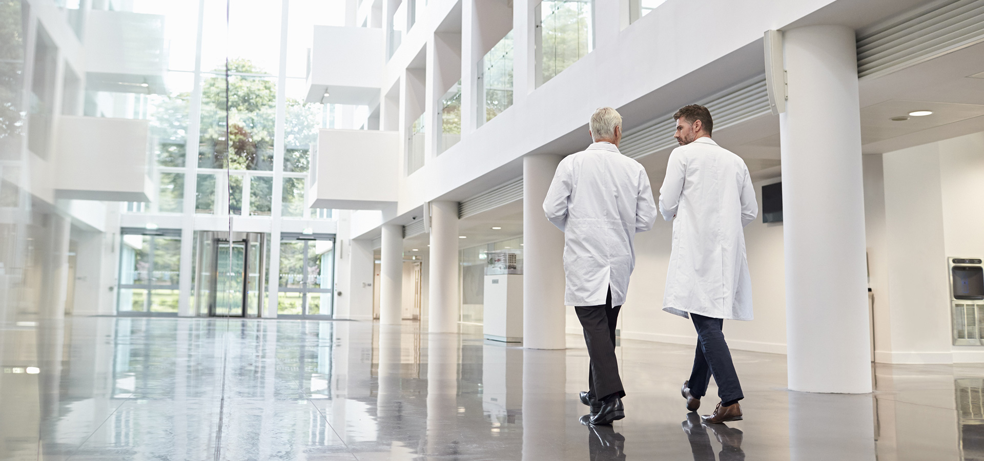 doctors walking hallway at hospital