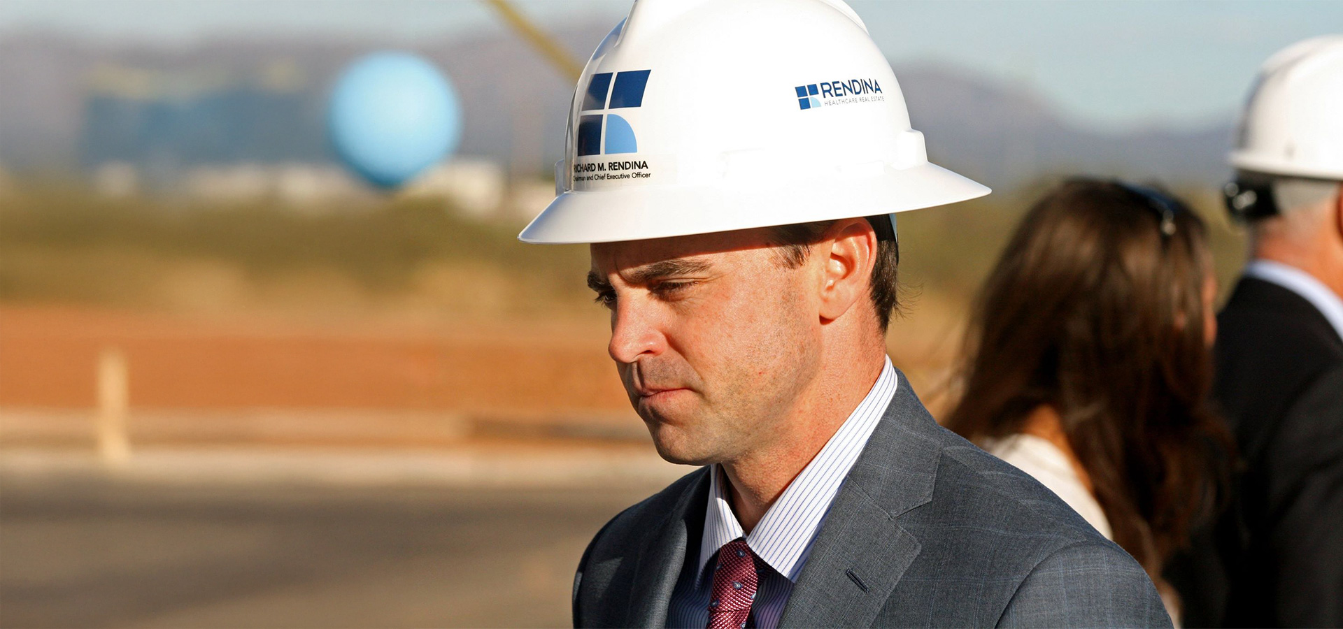 businessman in Rendina hard hat